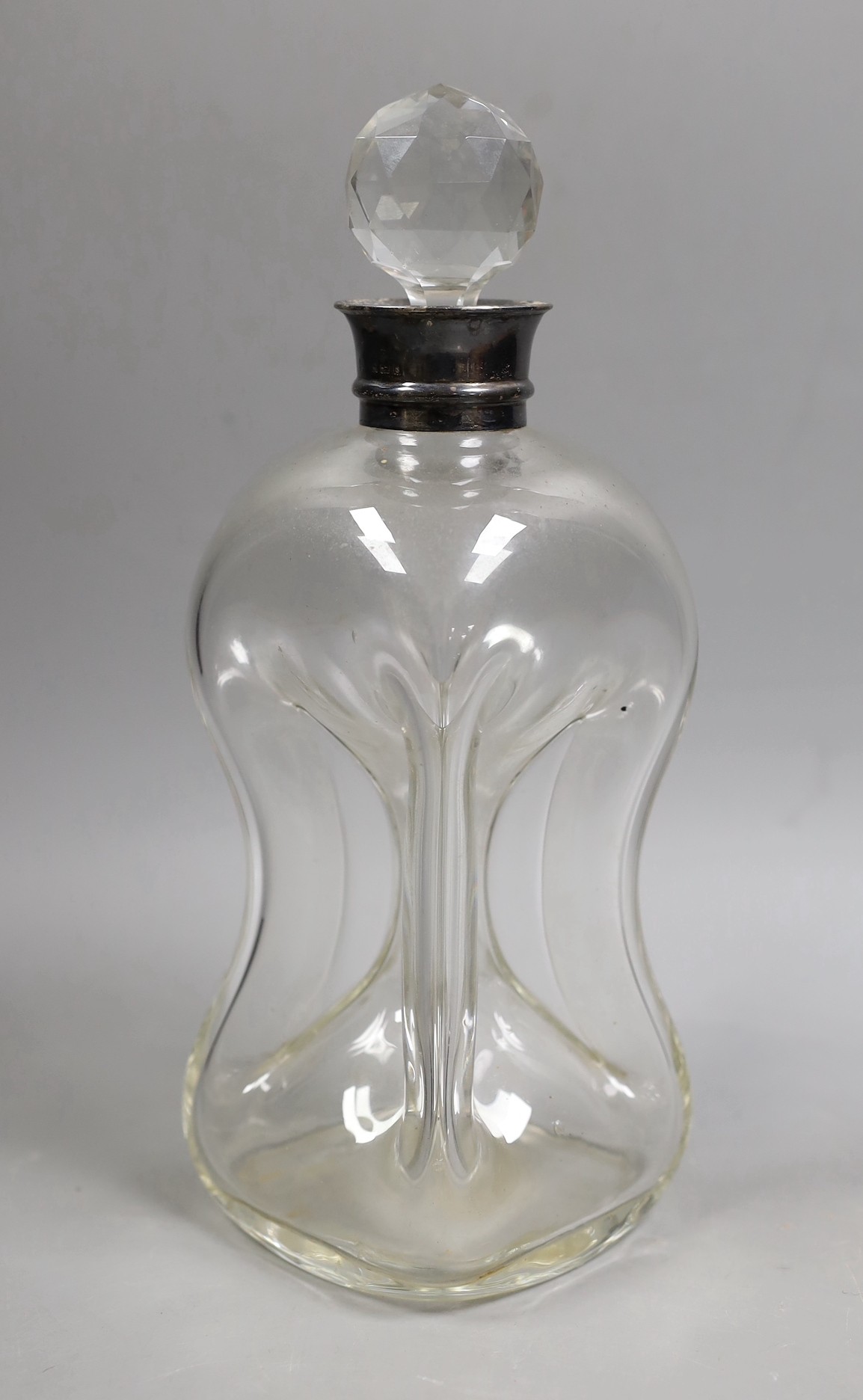 An Edwardian silver mounted waisted glass decanter and stopper, Hukin & Heath, Birmingham, 1906, height 28cm.